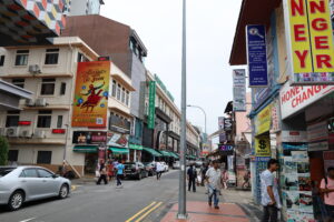 lively street scene taken in Chinatown, Singapore, with Mustafa Centre in the background