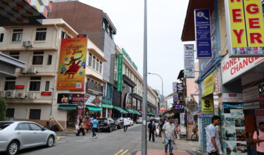 lively street scene taken in Chinatown, Singapore, with Mustafa Centre in the background