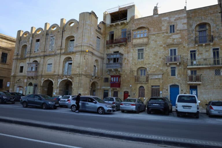 Grand corner building with stone architecture in Malta