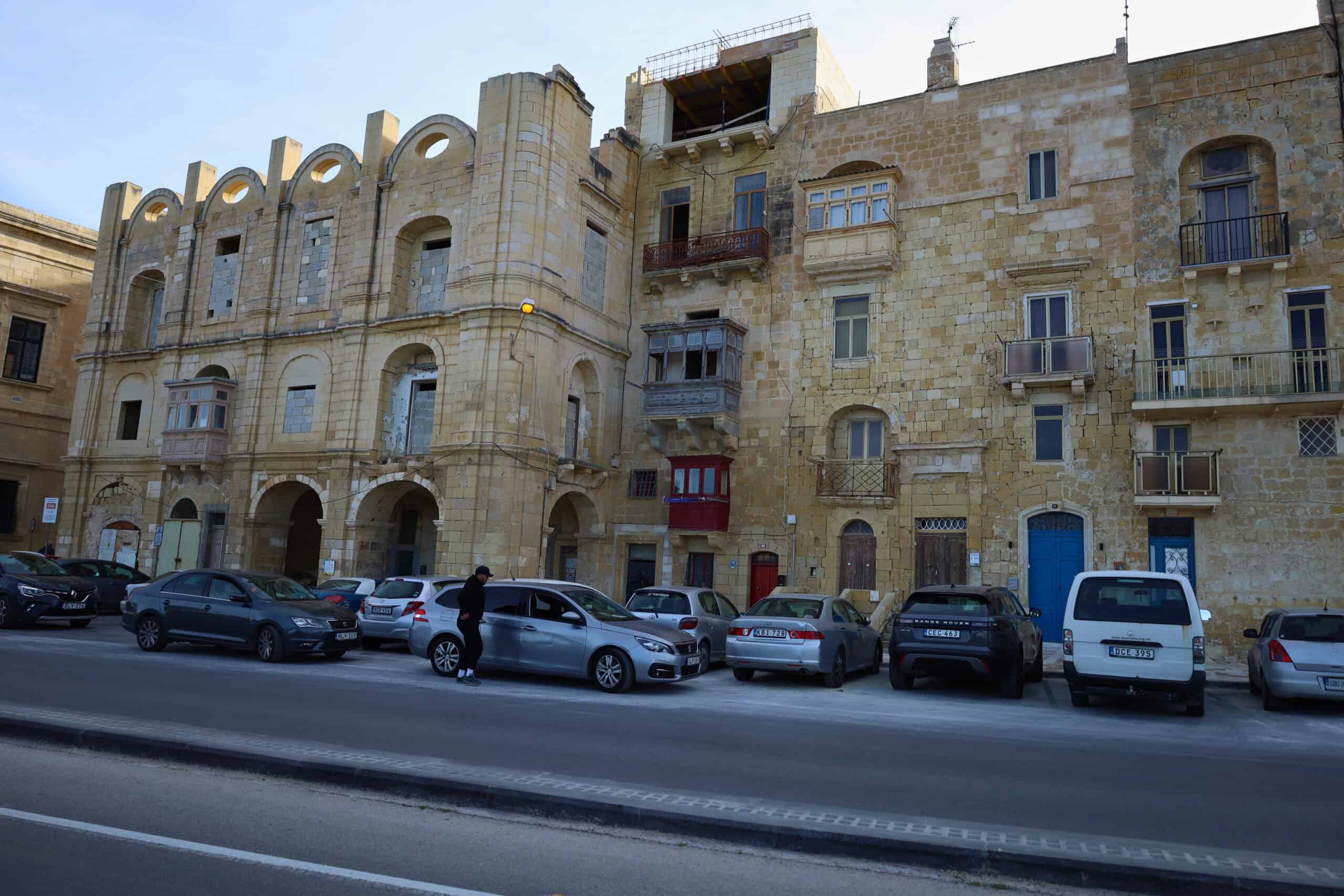 Grand corner building with stone architecture in Malta
