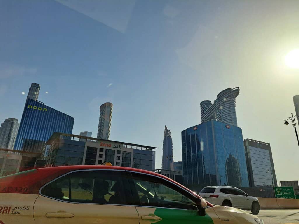 View of Dubai skyscrapers taken from inside a moving car