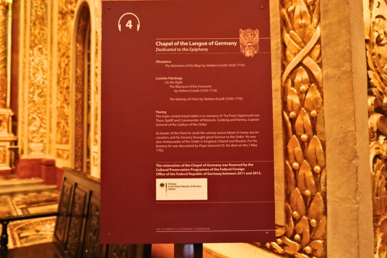 Informational panel inside St. John’s Co-Cathedral in Valletta