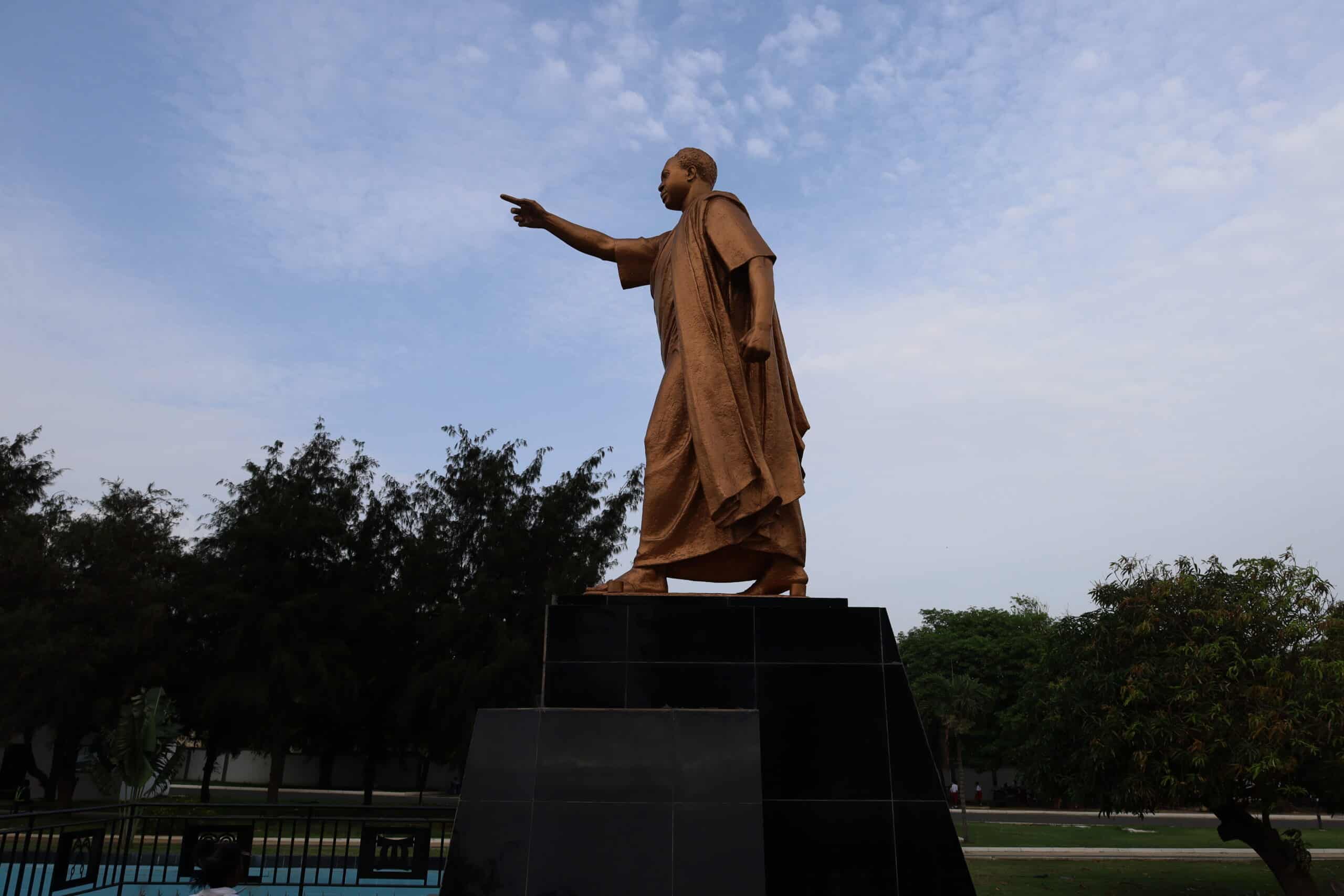 The towering statue of Kwame Nkrumah pointing forward at the memorial park in Accra.
