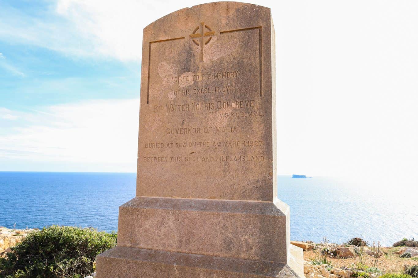 Stone memorial plaque facing the sea on the cliffs near Qrendi.