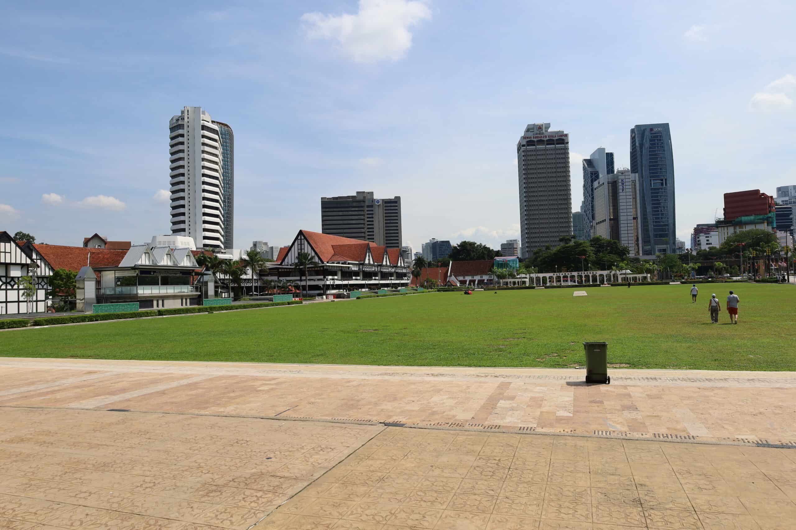 Open view of Merdeka Square with modern Kuala Lumpur skyline in the background