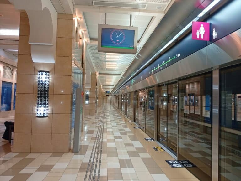 Clean and well-lit corridor at a Dubai Metro station