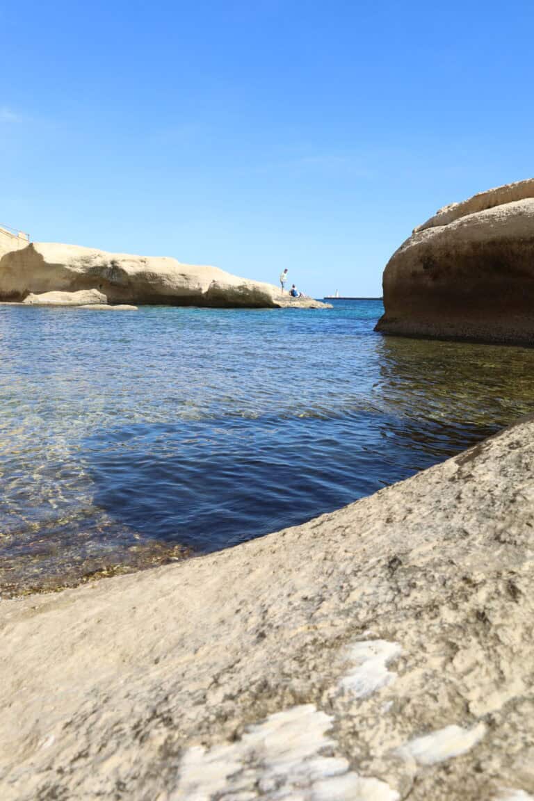 Hidden rocky bathing cove on the Maltese coast