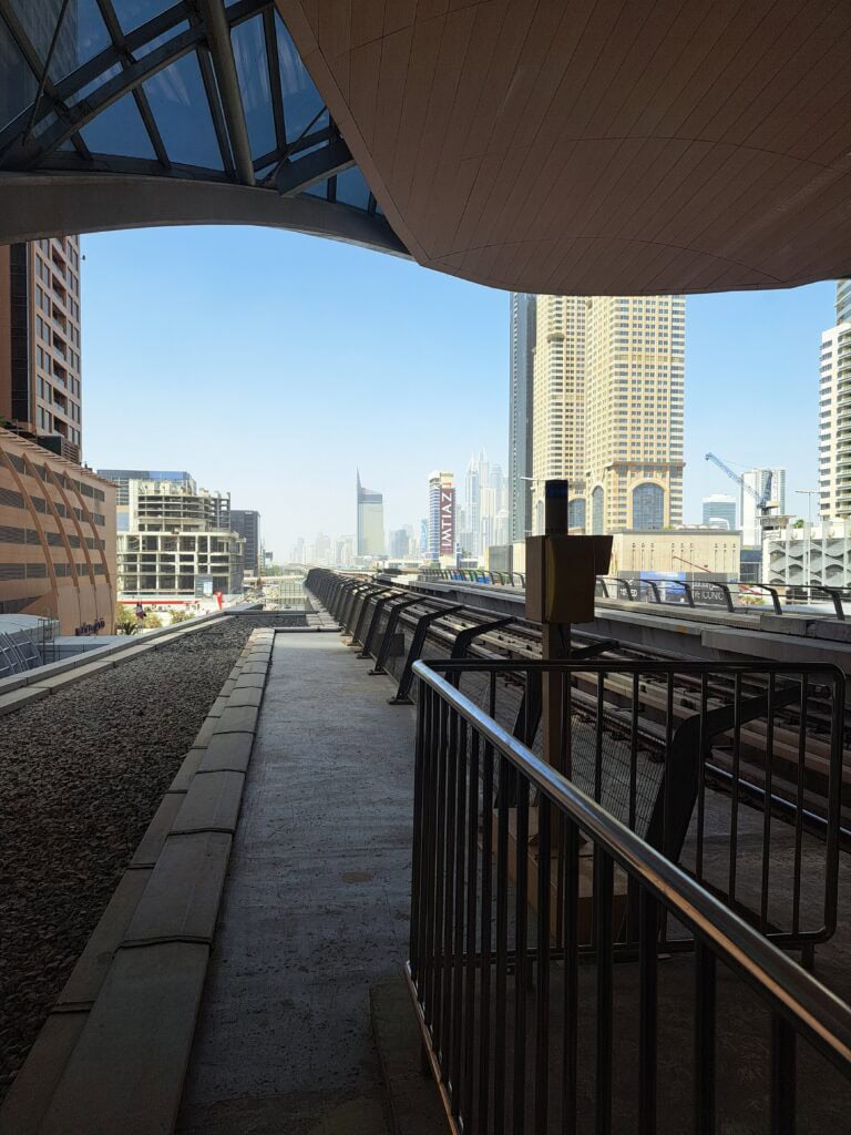 Rooftop terrace with tables overlooking Dubai skyscrapers