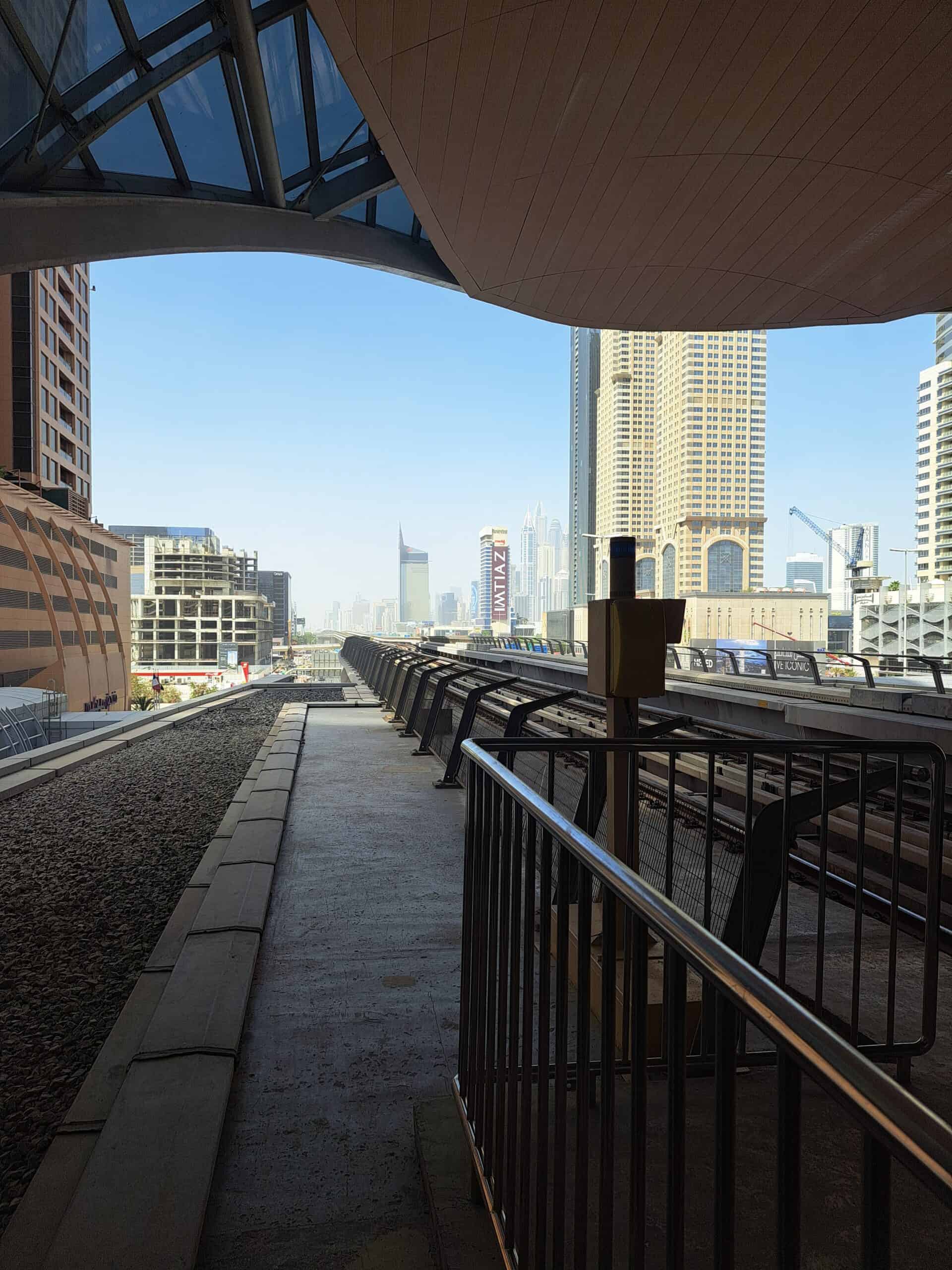 Rooftop terrace with tables overlooking Dubai skyscrapers