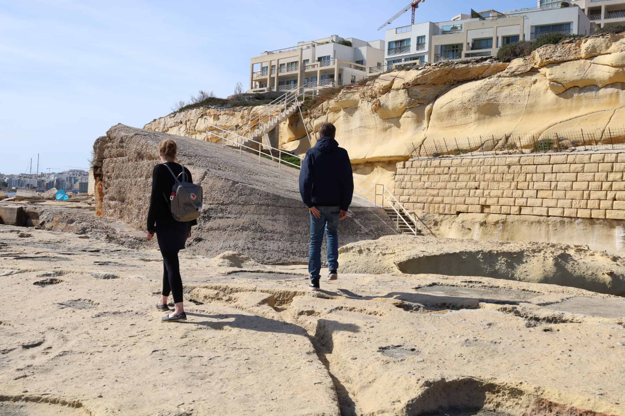 Tourists hiking on scenic cliffs near Valletta