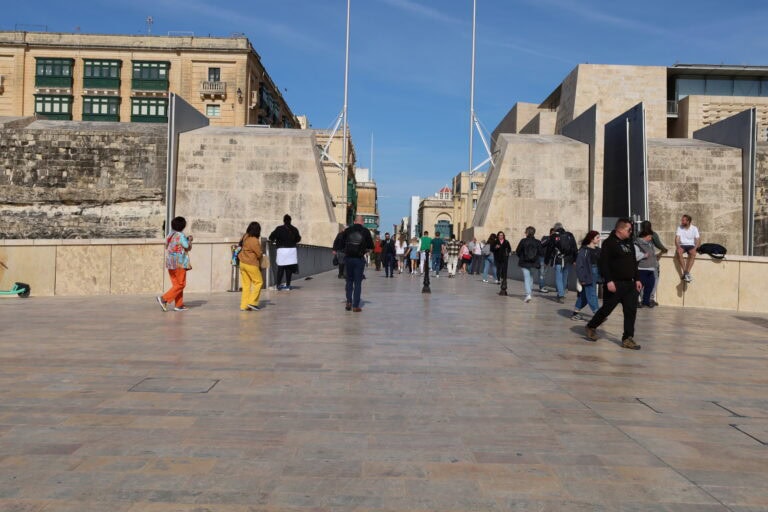 Visitors preparing to enter the historic city of Valletta