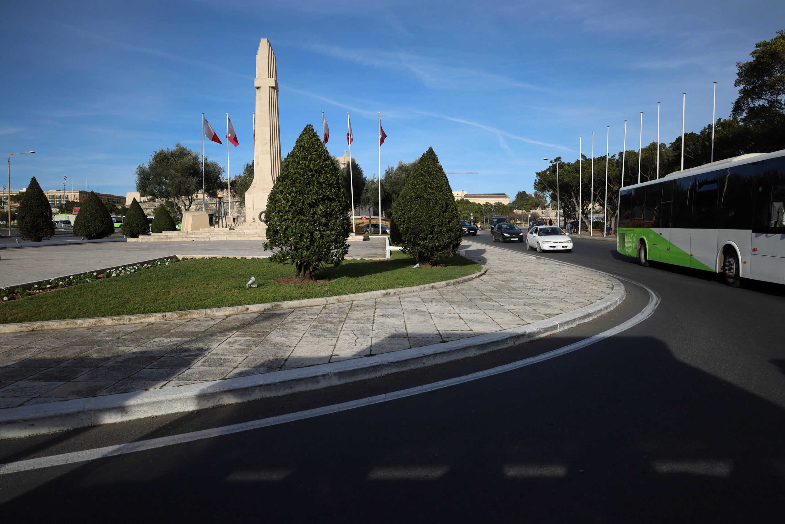 War memorial in Malta surrounded by national flags