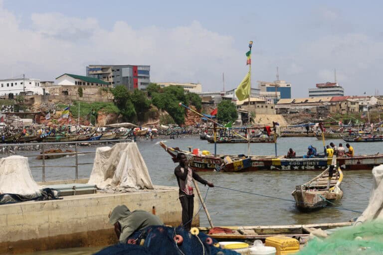 Fishermen preparing their wooden boats and fishing nets at Jamestown’s harbor in Accra.