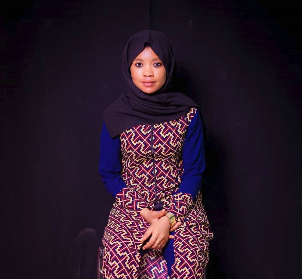 Monaya Daniels, Ghanaian contributor and radio host, photographed in traditional attire.