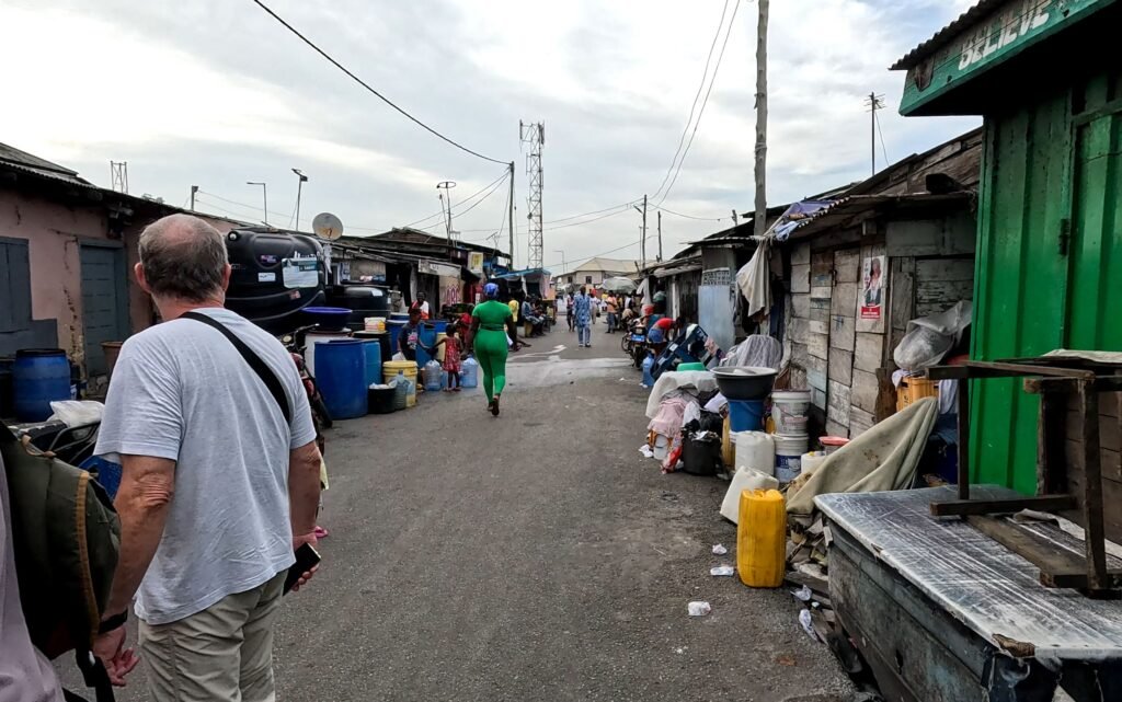 Local market street in Africa with visitors and residents going about their day.