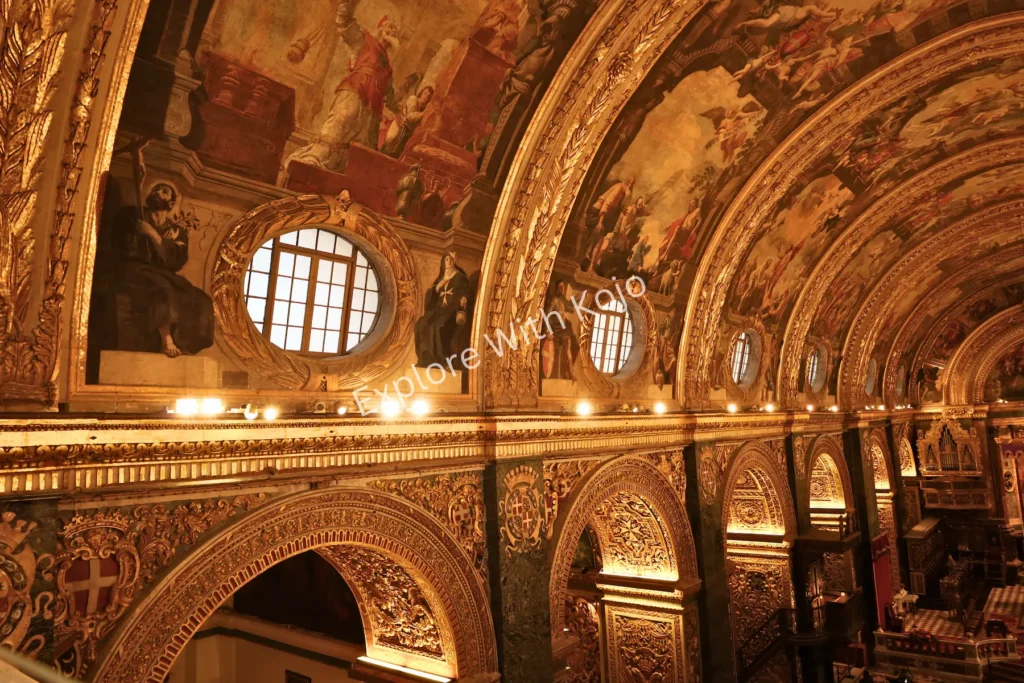 Golden arched ceiling with artwork in Valletta, Malta.