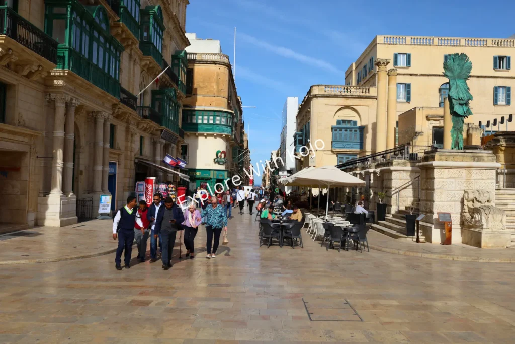 Crowds of people walking along Republic Street, Valletta, Malta.
