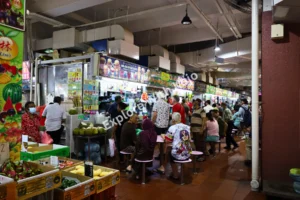 Crowds dining at hawker food stalls in Little India Singapore