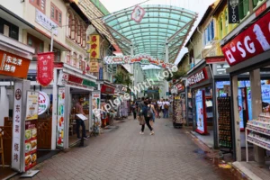 Chinatown Food Street in Singapore with restaurants and shops.