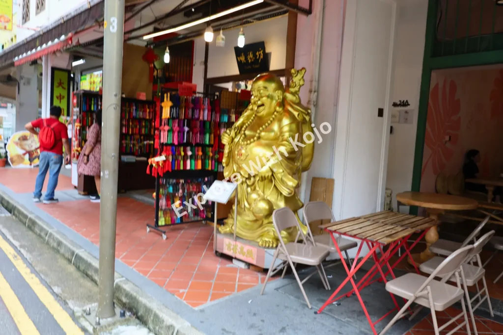 Golden statue outside shop in Chinatown Singapore.