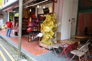 Golden statue outside shop in Chinatown Singapore.