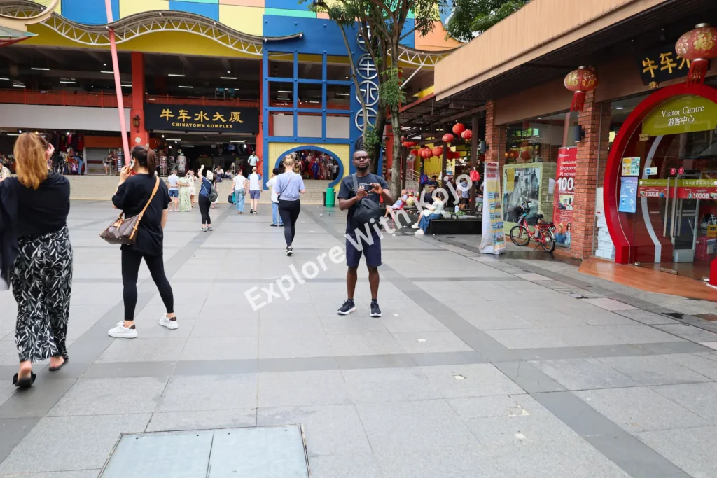 Tourists exploring Chinatown Singapore.