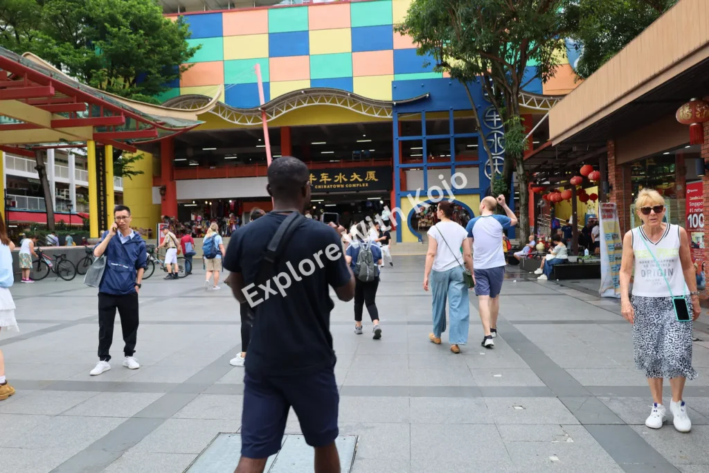 People walking in Chinatown Singapore street.