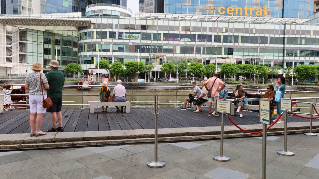 Tables and chairs along the riverside at Clarke Quay in Singapore