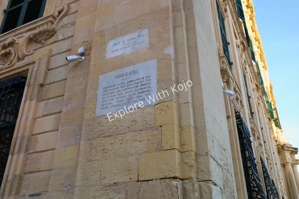 Limestone building with a commemorative plaque in Valletta, Malta.
