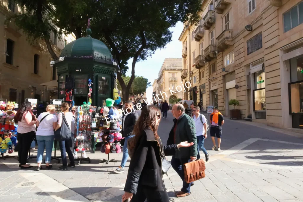 Crowds of people walking in Valletta, Malta.