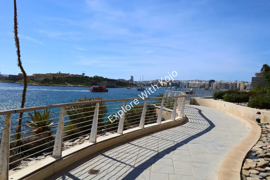 Curved seaside walkway with sea view in Malta.