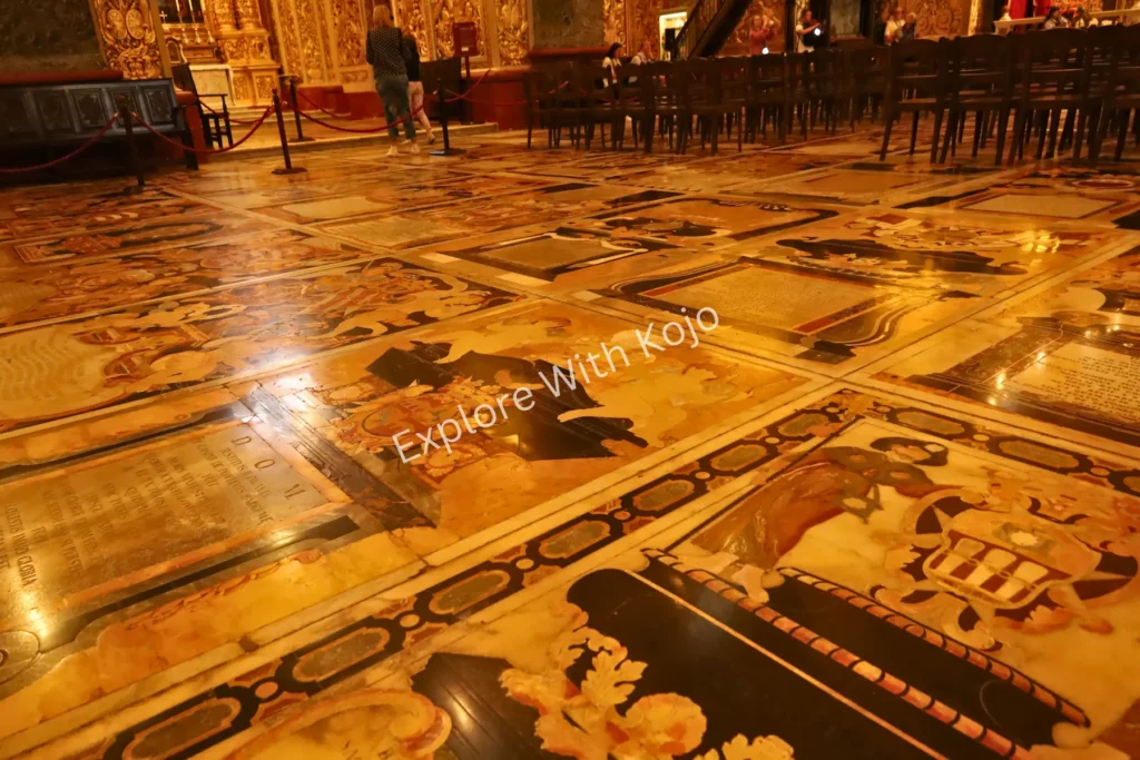 Intricate marble tombstones and decorations on the floor of St. John&rsquo;s Co-Cathedral, Valletta, Malta.