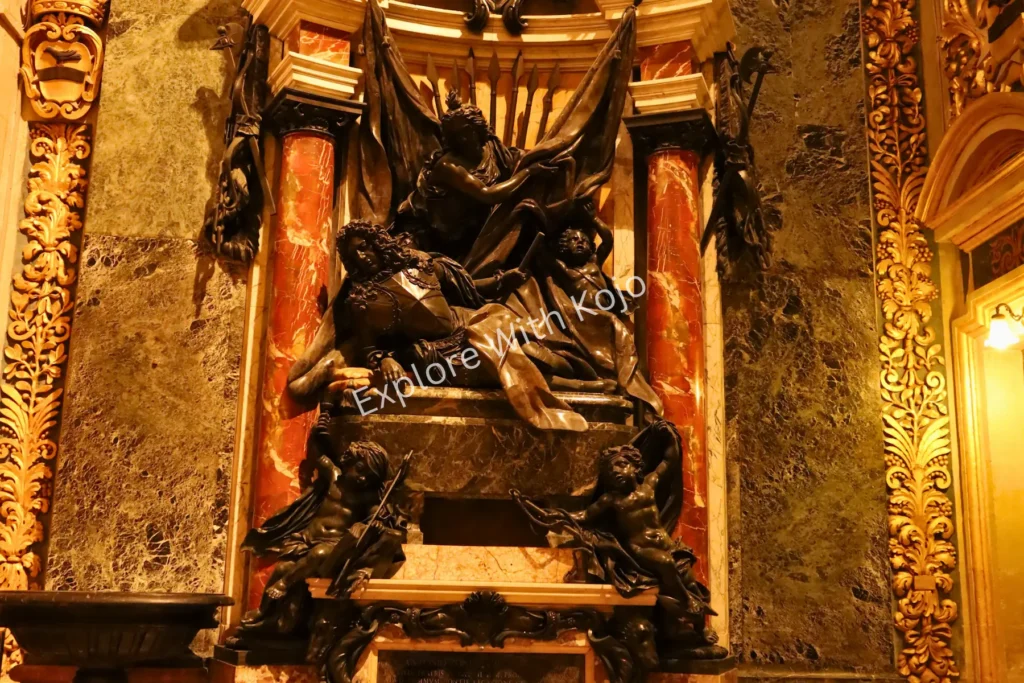 Detailed Baroque sculpture on tomb inside St. John&rsquo;s Co-Cathedral, Valletta, Malta.