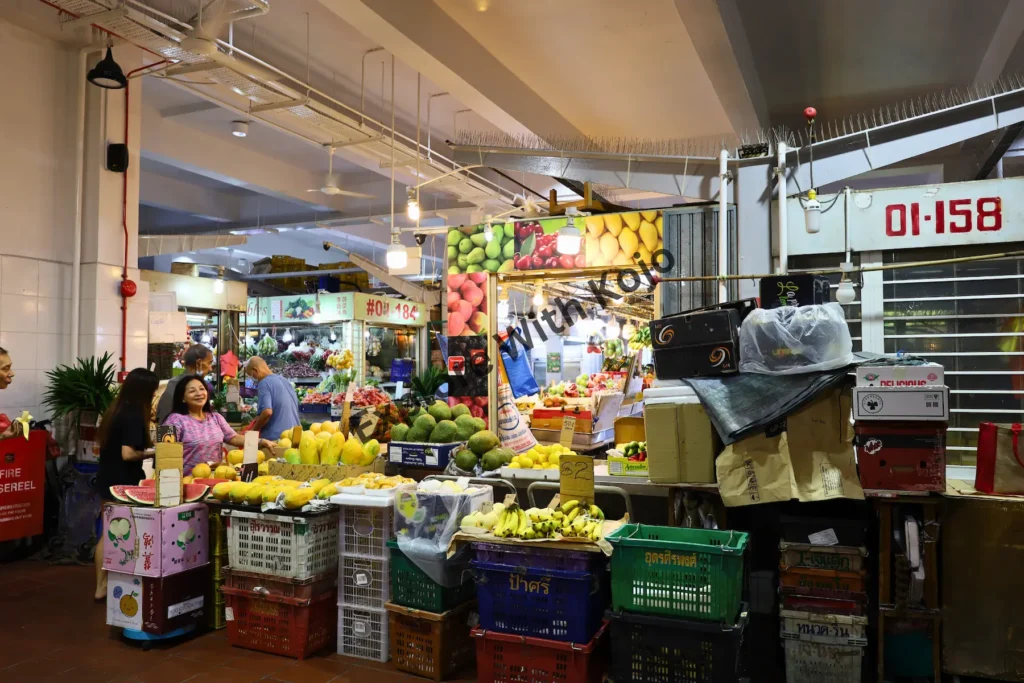 Brightly lit fr uit and grocery stalls in Little India Singapore
