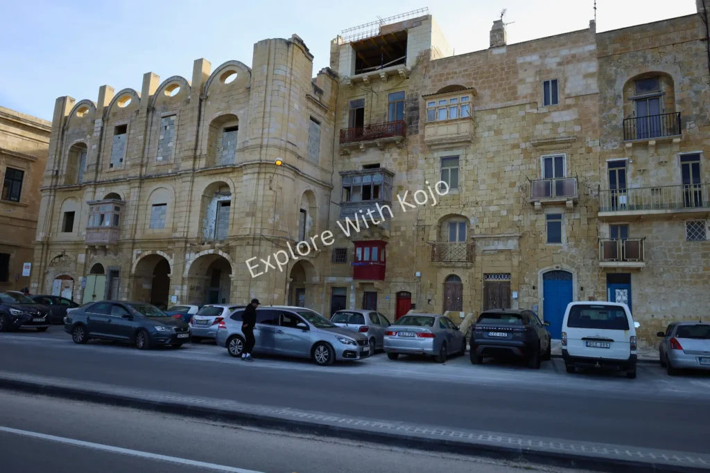 Limestone government building with parked cars in Valletta,&nbsp;Malta.