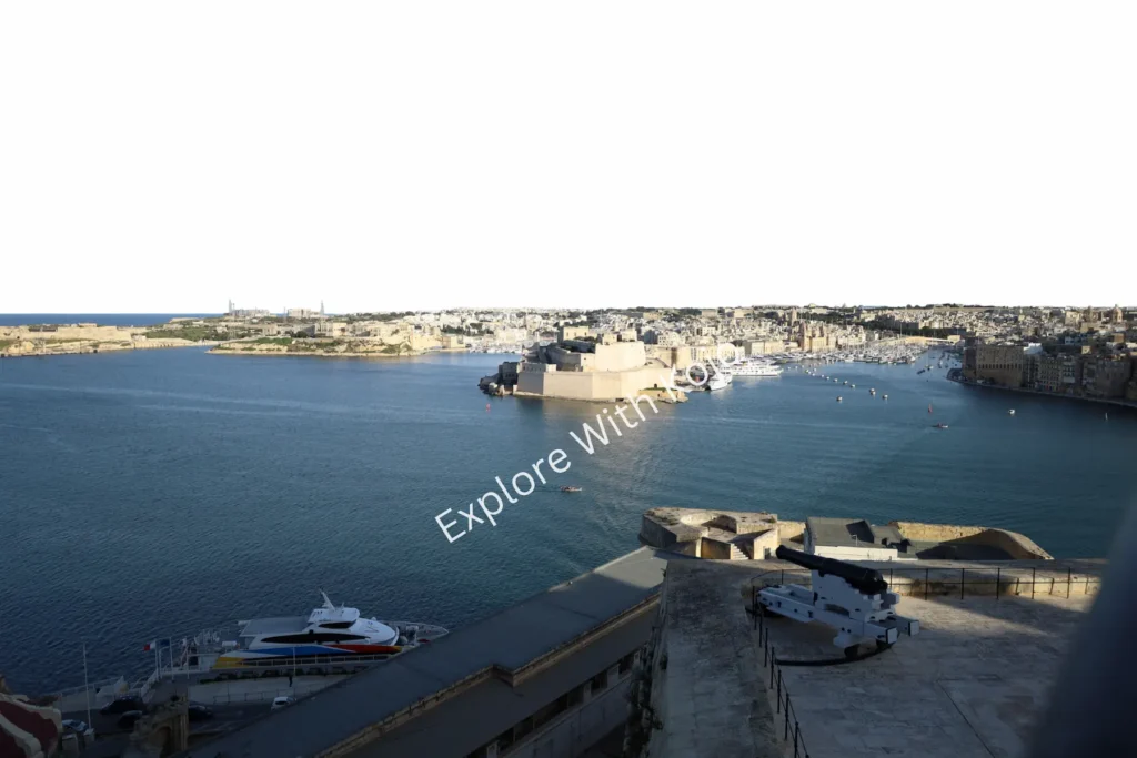 Yachts docked in Malta&rsquo;s harbor with city view in&nbsp;the&nbsp;background.