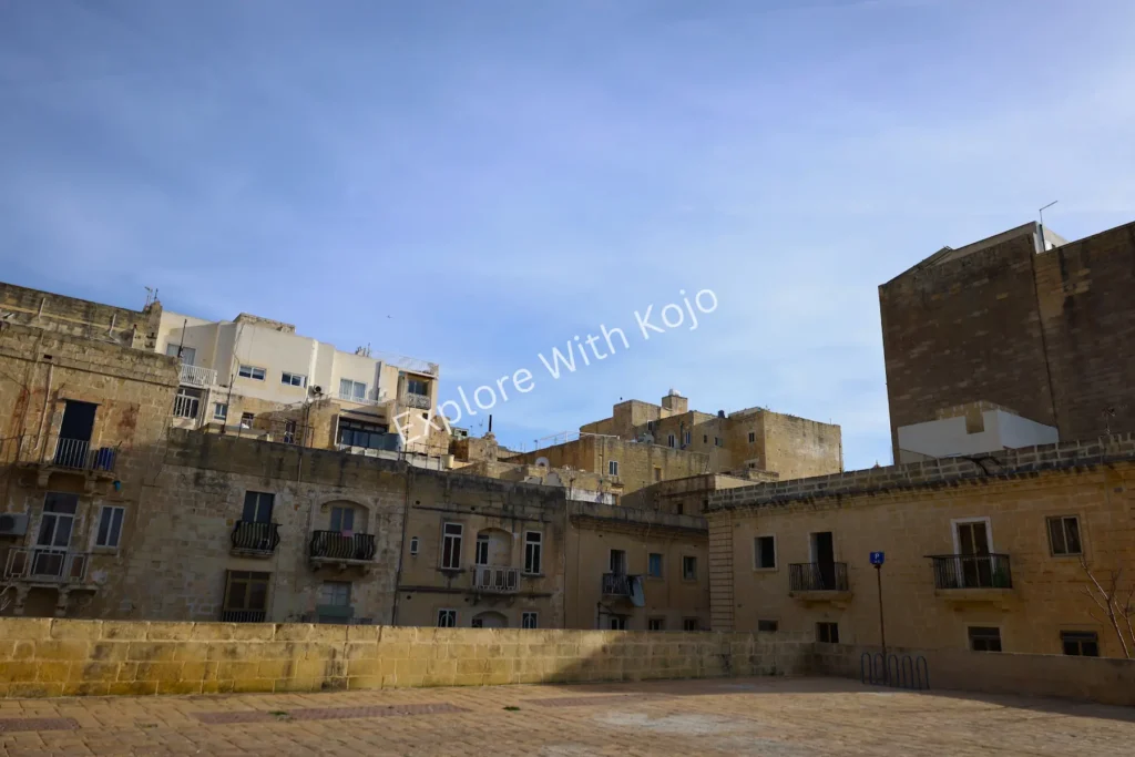 Stone fortification walls with clear blue sky in Valletta, Malta.
