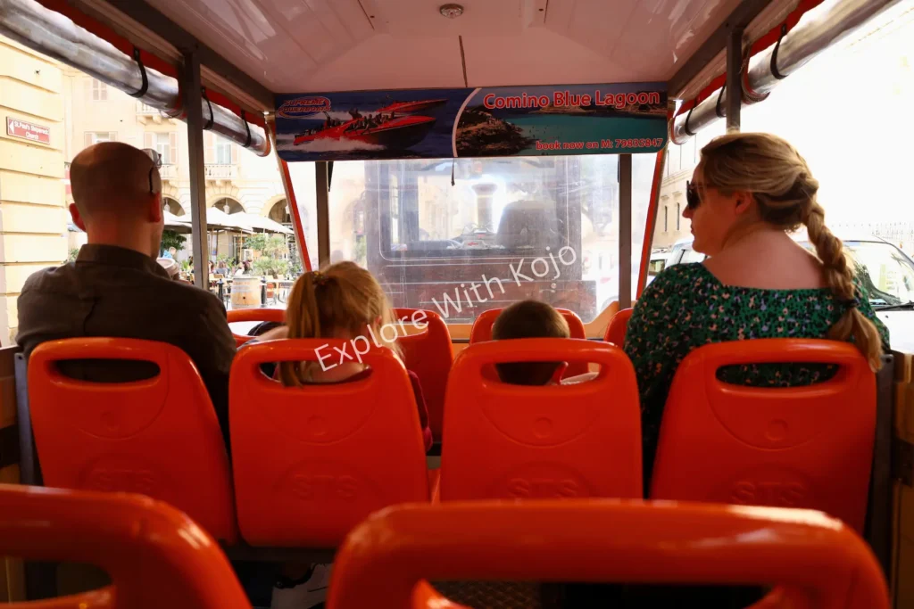 Passengers seated on a hop-on hop-off sightseeing tour&nbsp;bus&nbsp;in&nbsp;Malta.