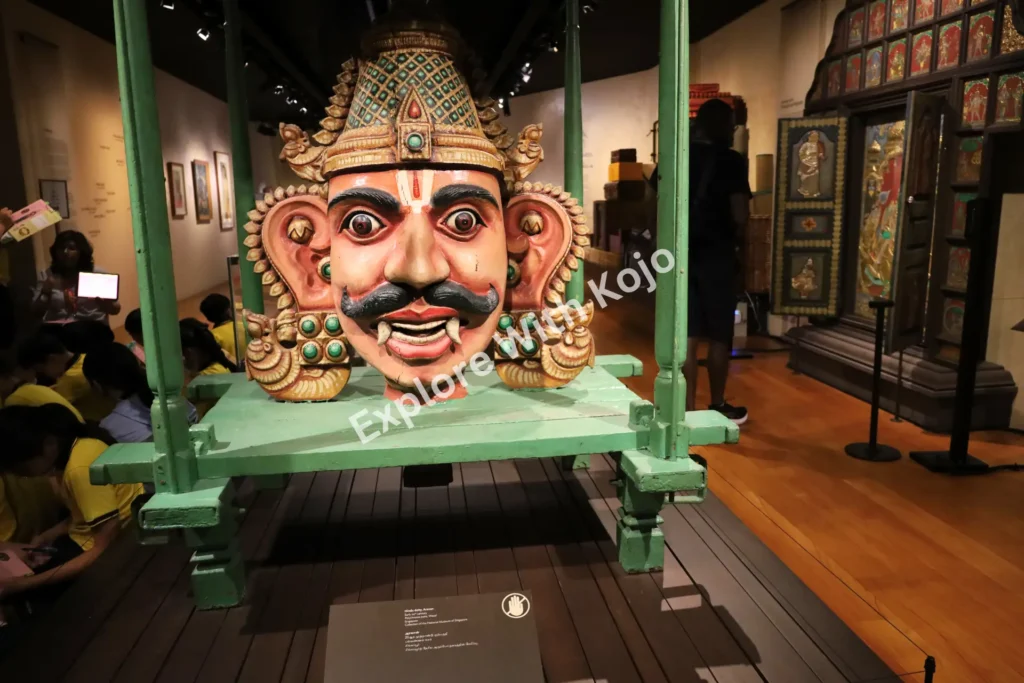 Large traditional demon mask on display at Indian Heritage Centre Singapore