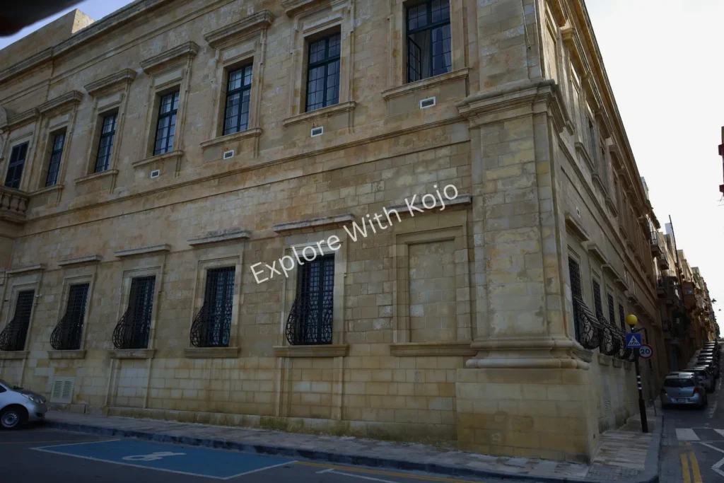 Limestone facade of a historic building in Valletta, Malta.