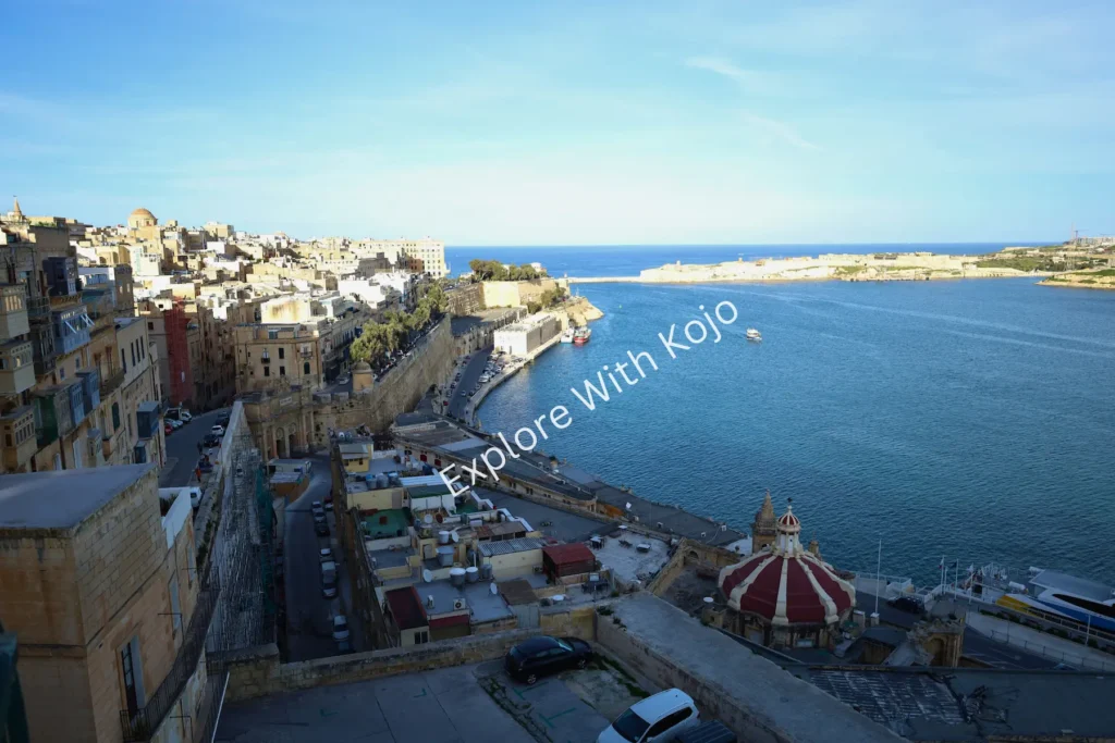 Panoramic harbor view with sea and boats in Marsamxett, Malta.