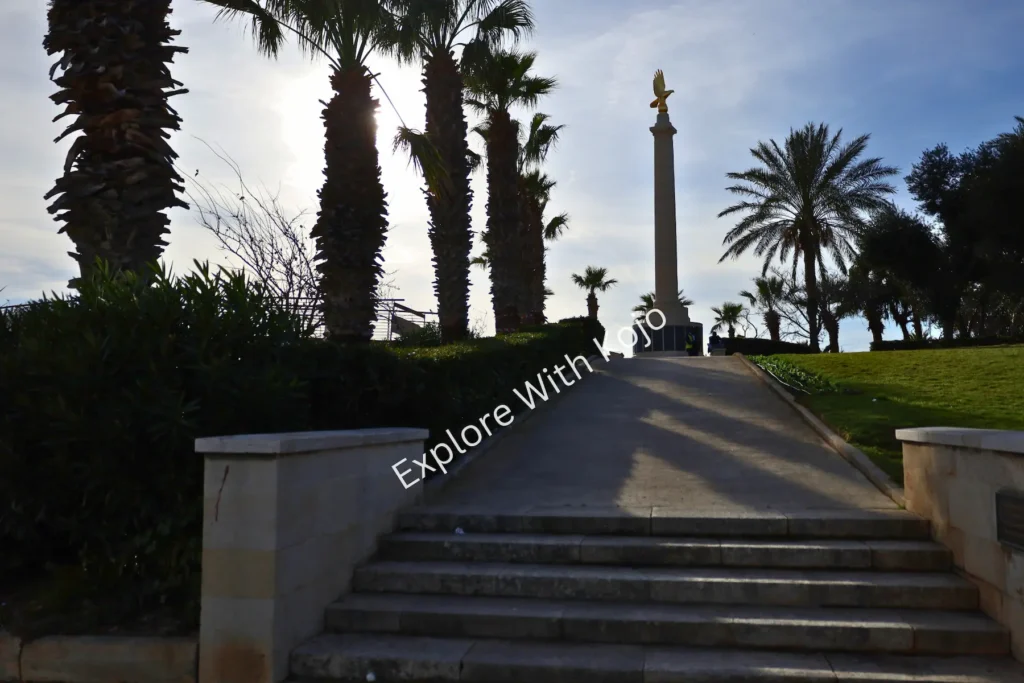 Monument surrounded by palm trees in Malta.