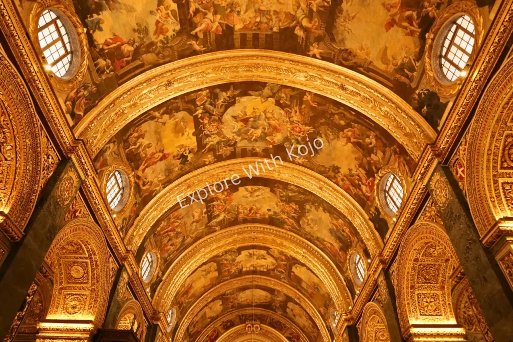 Ornate painted ceiling with religious artwork inside St. John&rsquo;s Co-Cathedral, Valletta, Malta.
