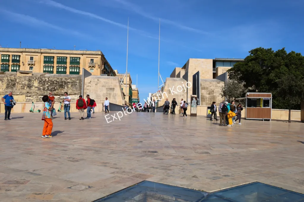 People gathered at the entrance of City Gate in Valletta, Malta.
