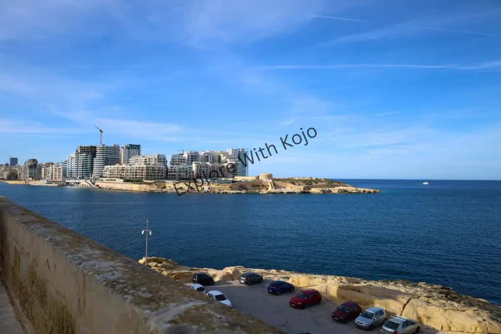 Promenade by the seafront with a coastal city&nbsp;view&nbsp;in&nbsp;Malta.