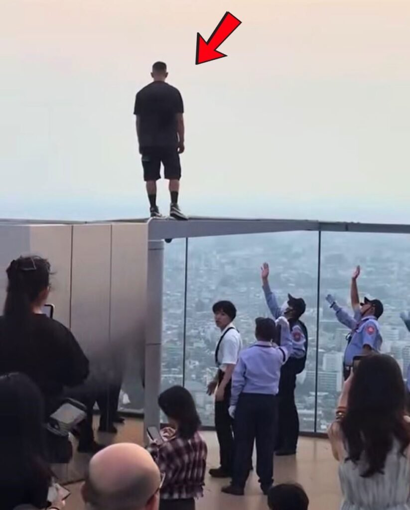 Shibuya Sky man on ledge