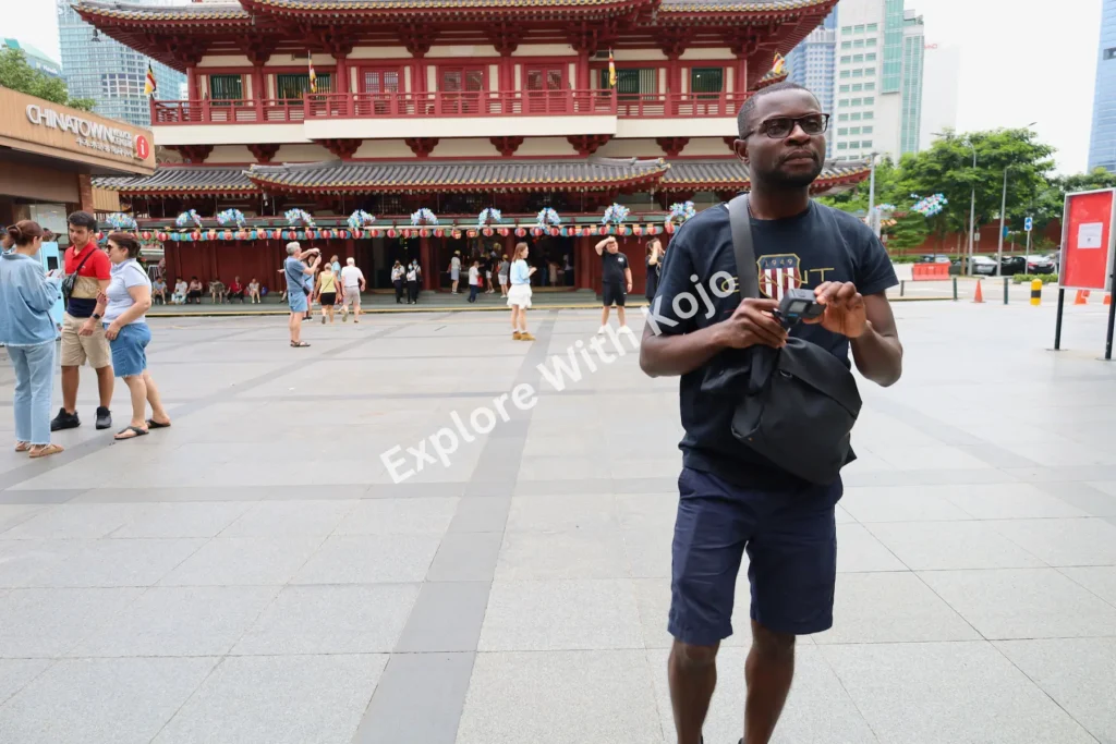 Kojo in front of Buddha Tooth Relic Temple Chinatown Singapore.