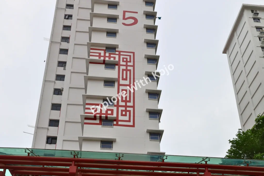 Chinatown Singapore HDB block with red Chinese character design.