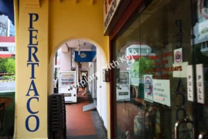 Chinatown heritage arcade with colorful shopfronts in Singapore.