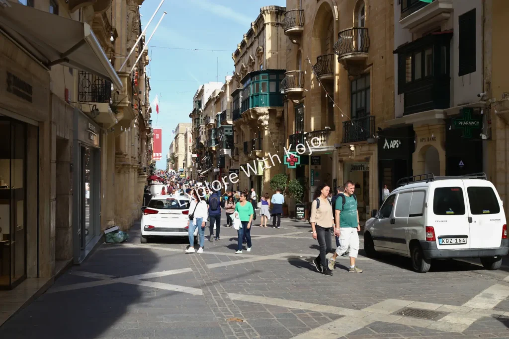 Valletta Malta street scene with pedestrians.